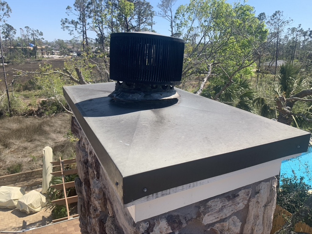 newly installed chimney cap and chase cover on prefab chimney in Dothan