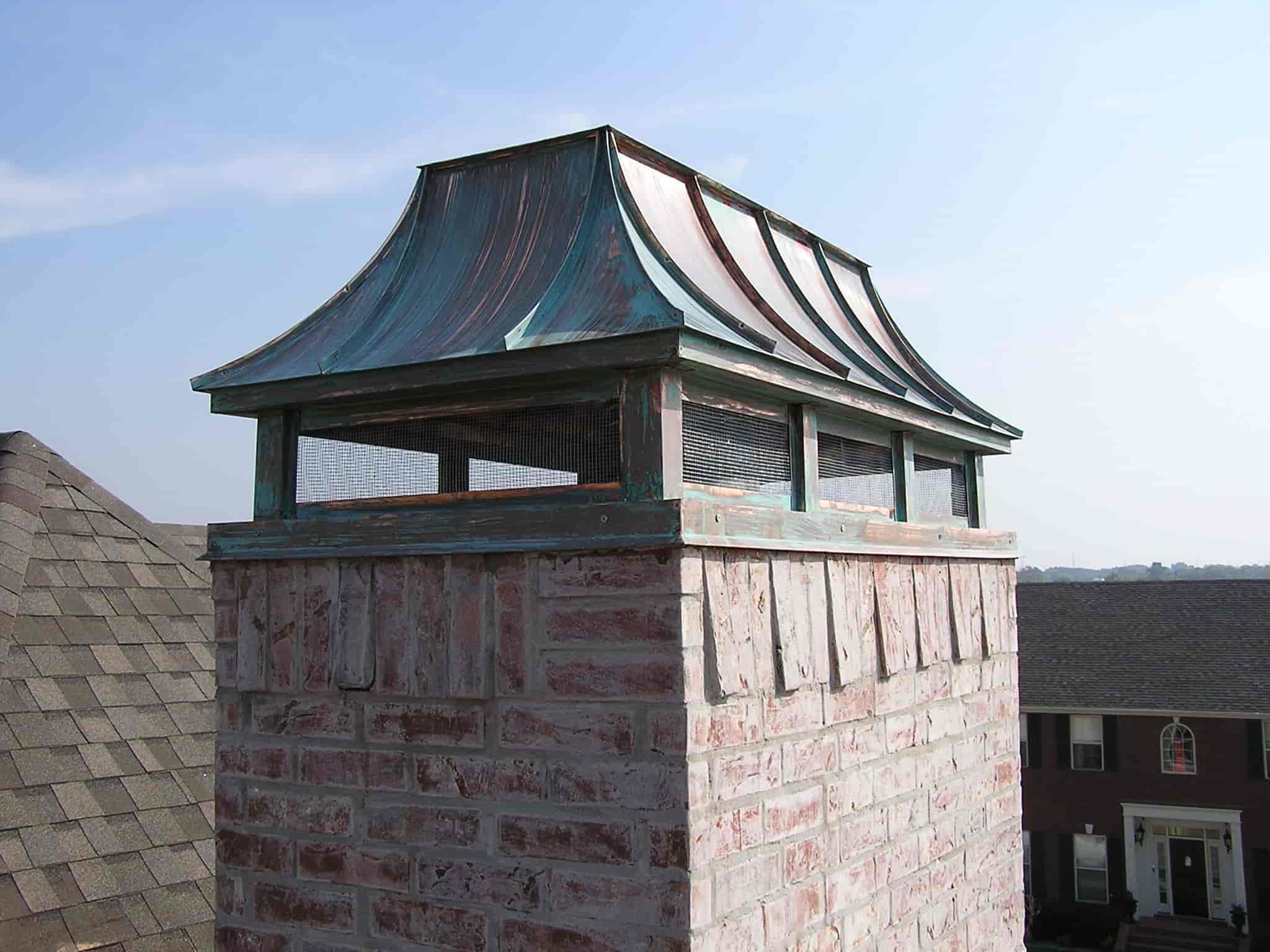 patina chimney cap installation on masonry chimney