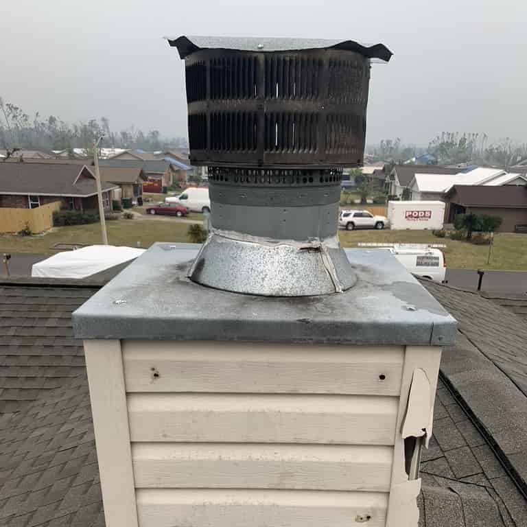 West Lake Sootmaster team repairing storm damaged chimney