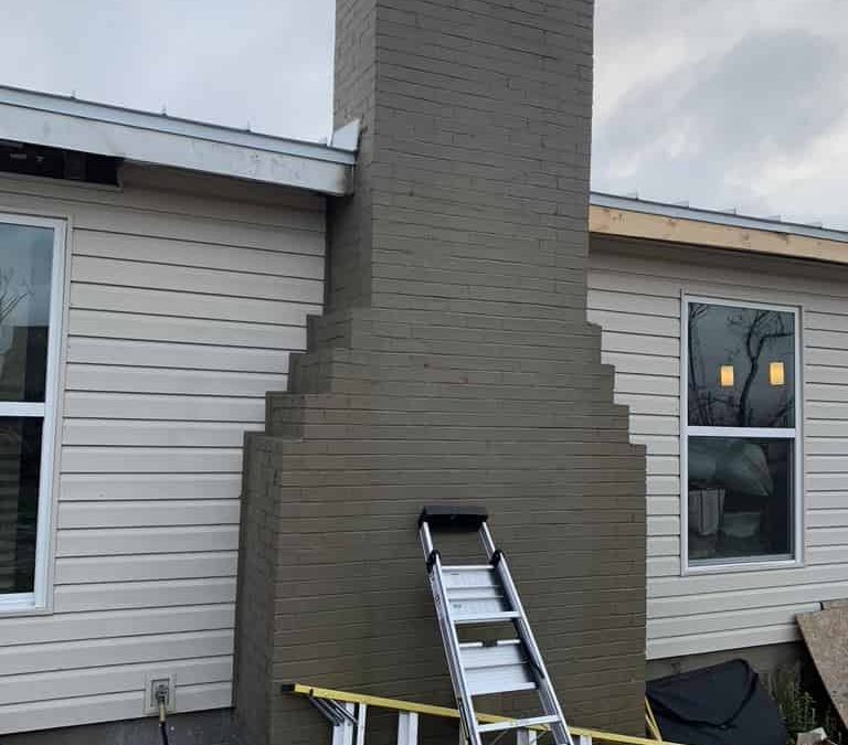 corbeled masonry chimney on outside of Prattville home