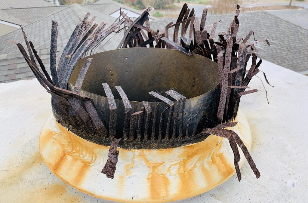 Damage rusty chimney cap