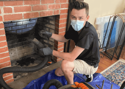 Chimney sweep michael inspecting the inside of a fireplace in jacksonville
