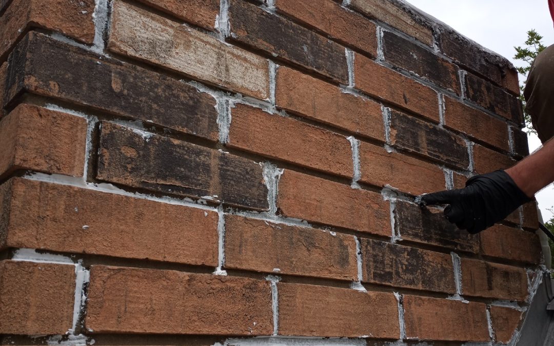 Stone chimney being cleaned