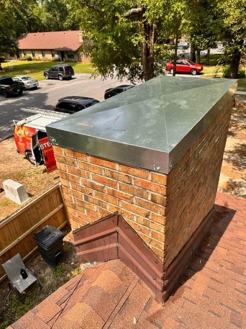 A sealed off chimney/cap in Pensacola, FL, providing protection and preventing debris and animals from entering the chimney